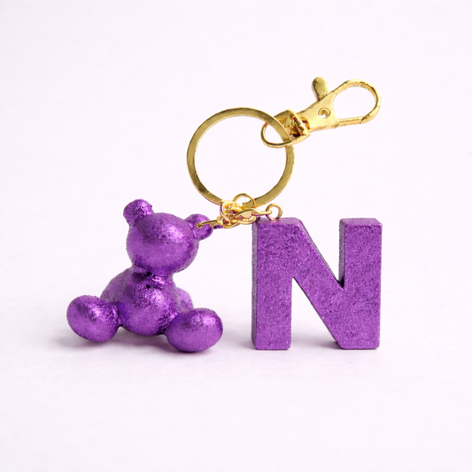 Purple handmade resin bear keychain with the letter N