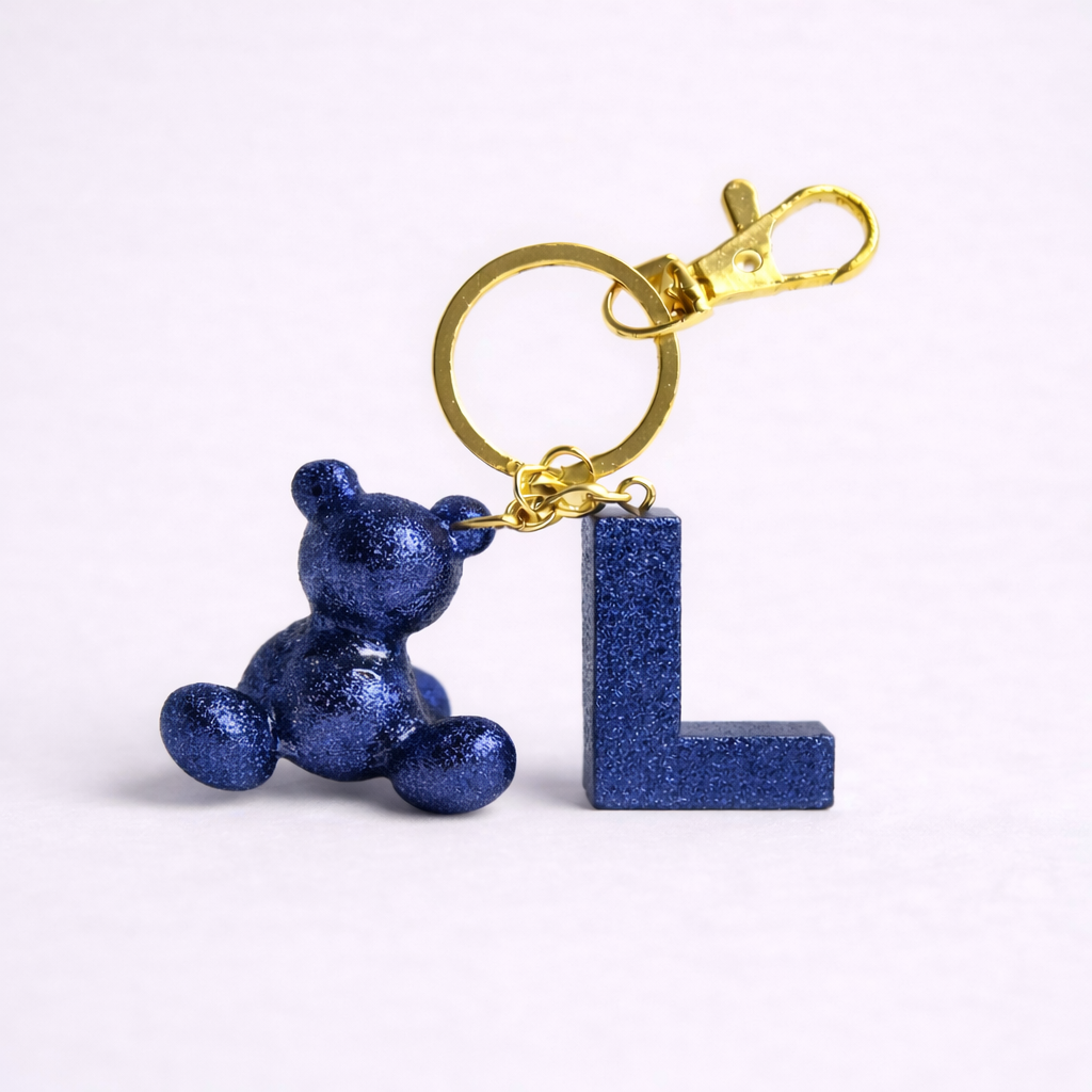 Blue handmade resin bear keychain with the letter L