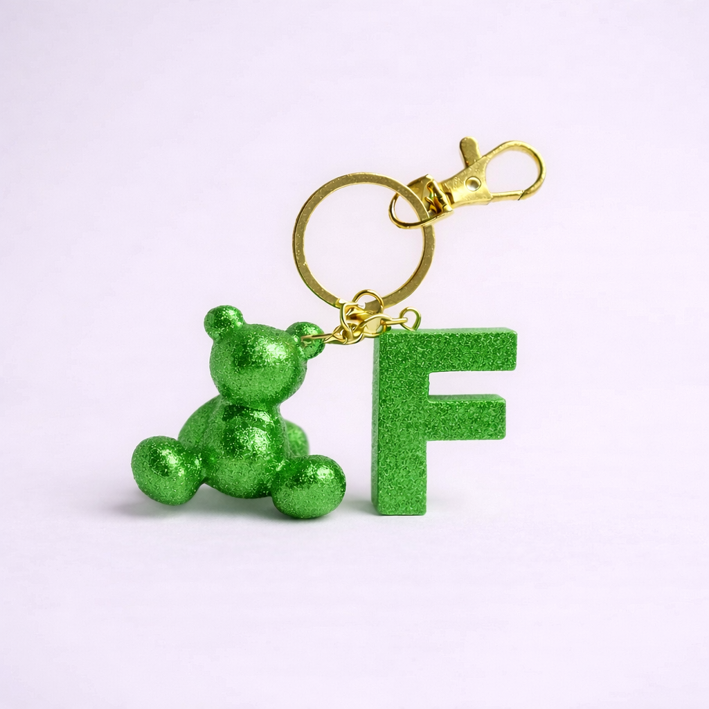 Green handmade resin bear keychain with the letter F