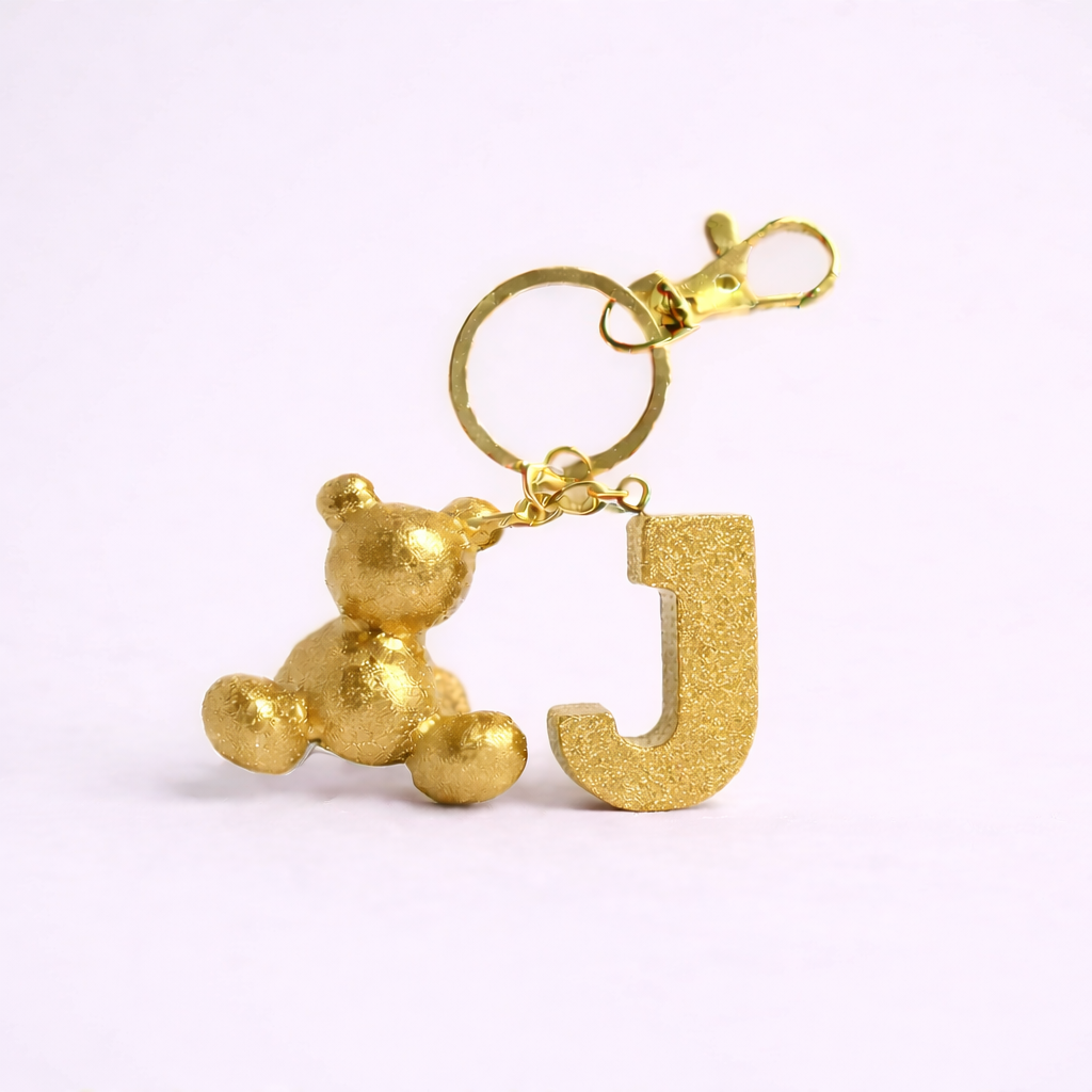 Gold handmade resin bear keychain with the letter J