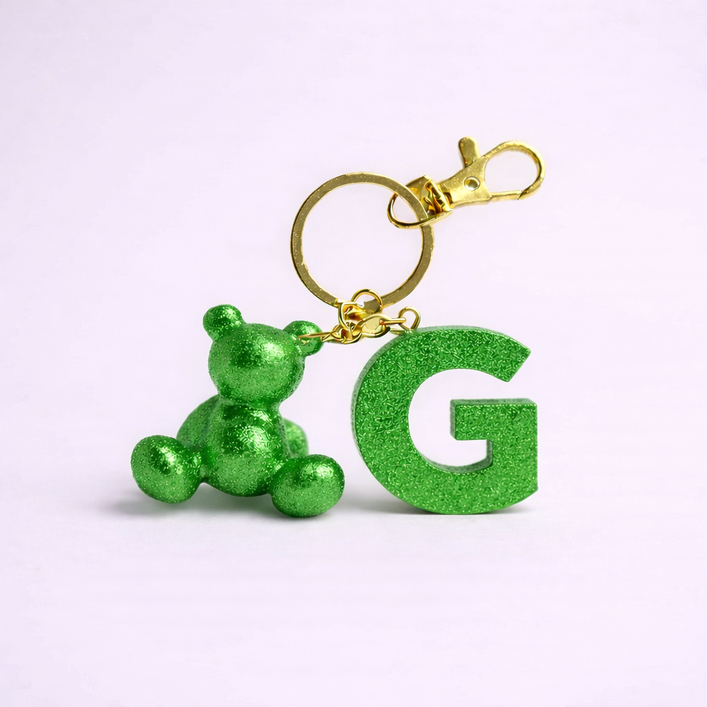 Green handmade resin bear keychain with the letter G