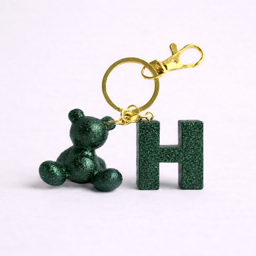 Green handmade resin bear keychain with the letter H