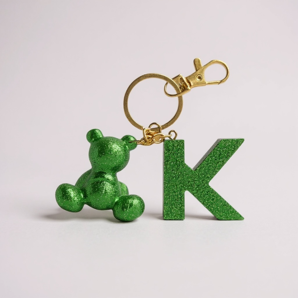 Green handmade resin bear keychain with the letter K