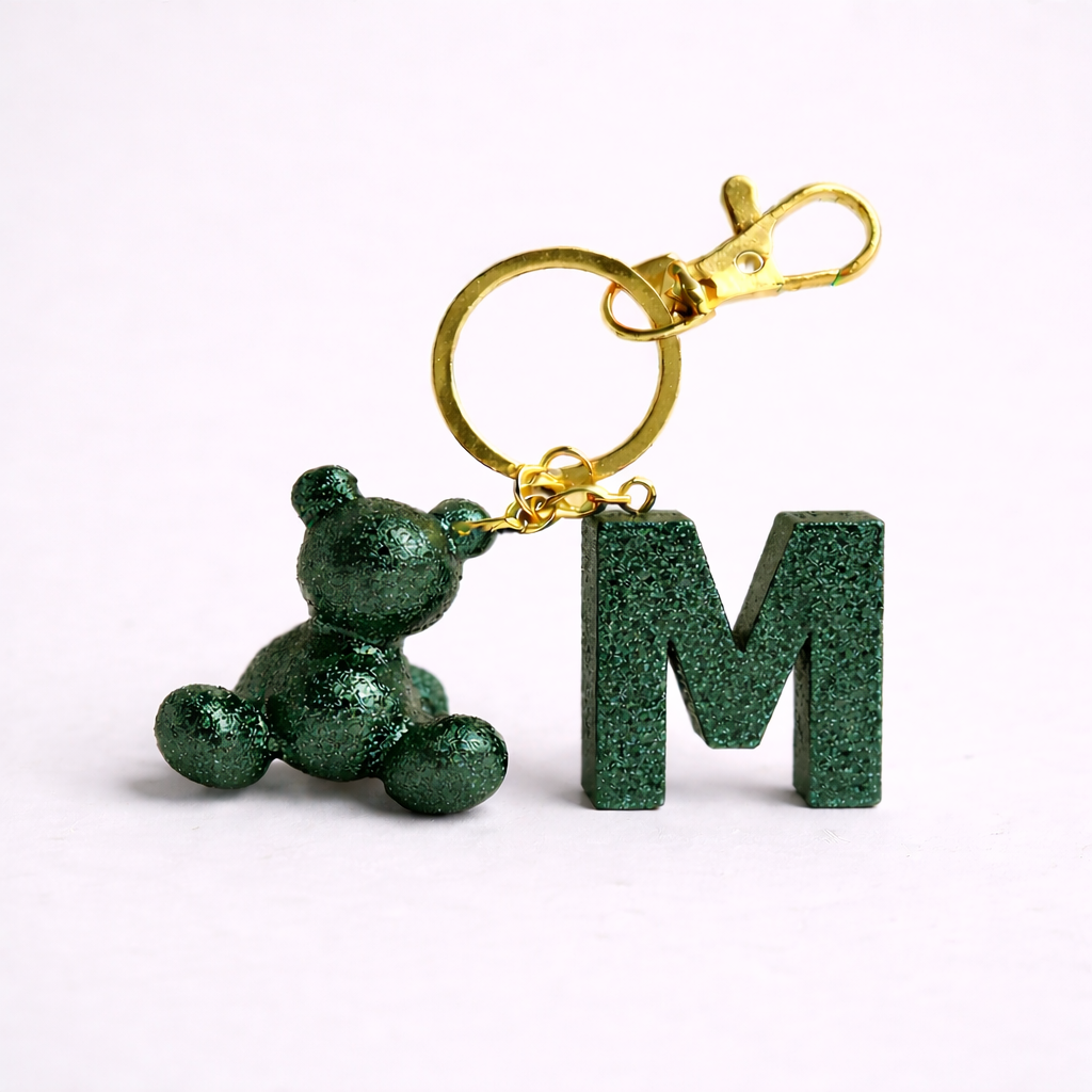 Green handmade resin bear keychain with the letter M