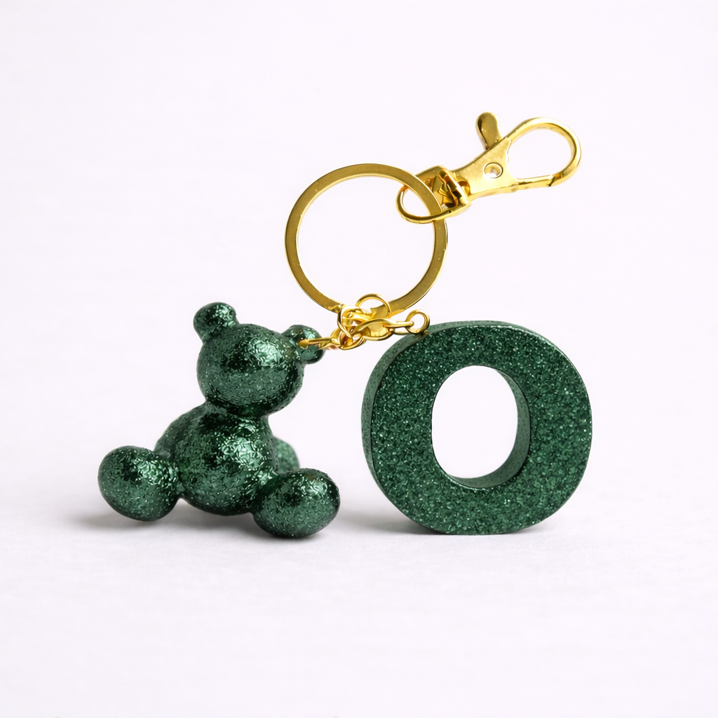 Green handmade resin bear keychain with the letter O