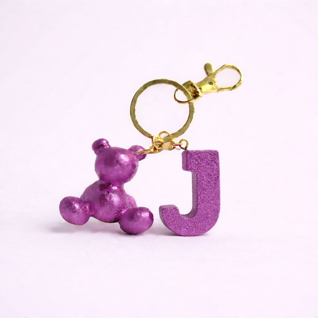 Purple handmade resin bear keychain with the letter J
