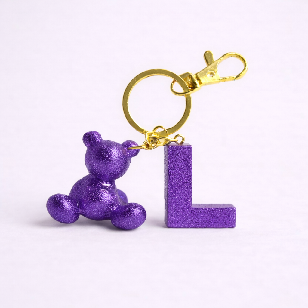 Purple handmade resin bear keychain with the letter L
