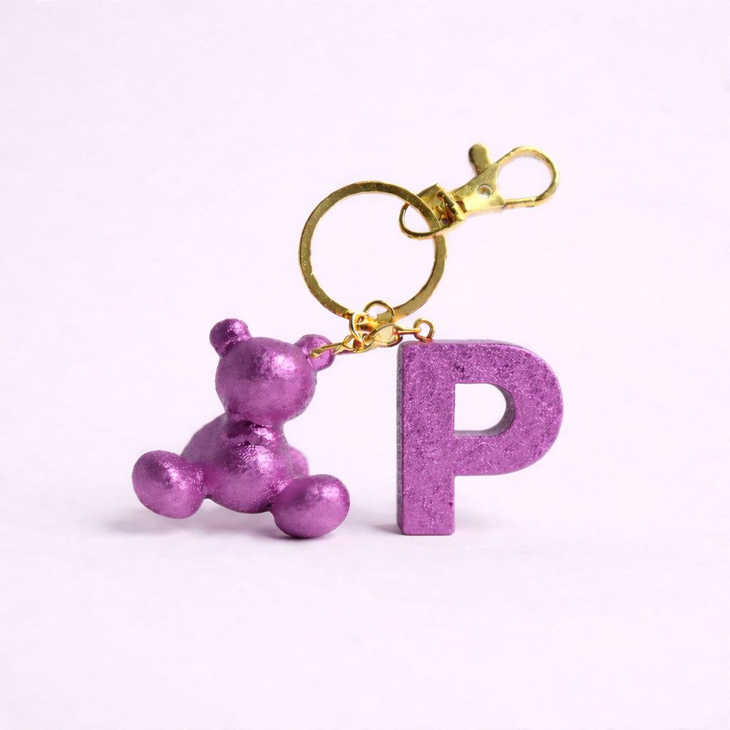 Purple handmade resin bear keychain with the letter P