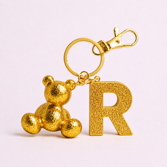 Gold handmade resin bear keychain with the letter R