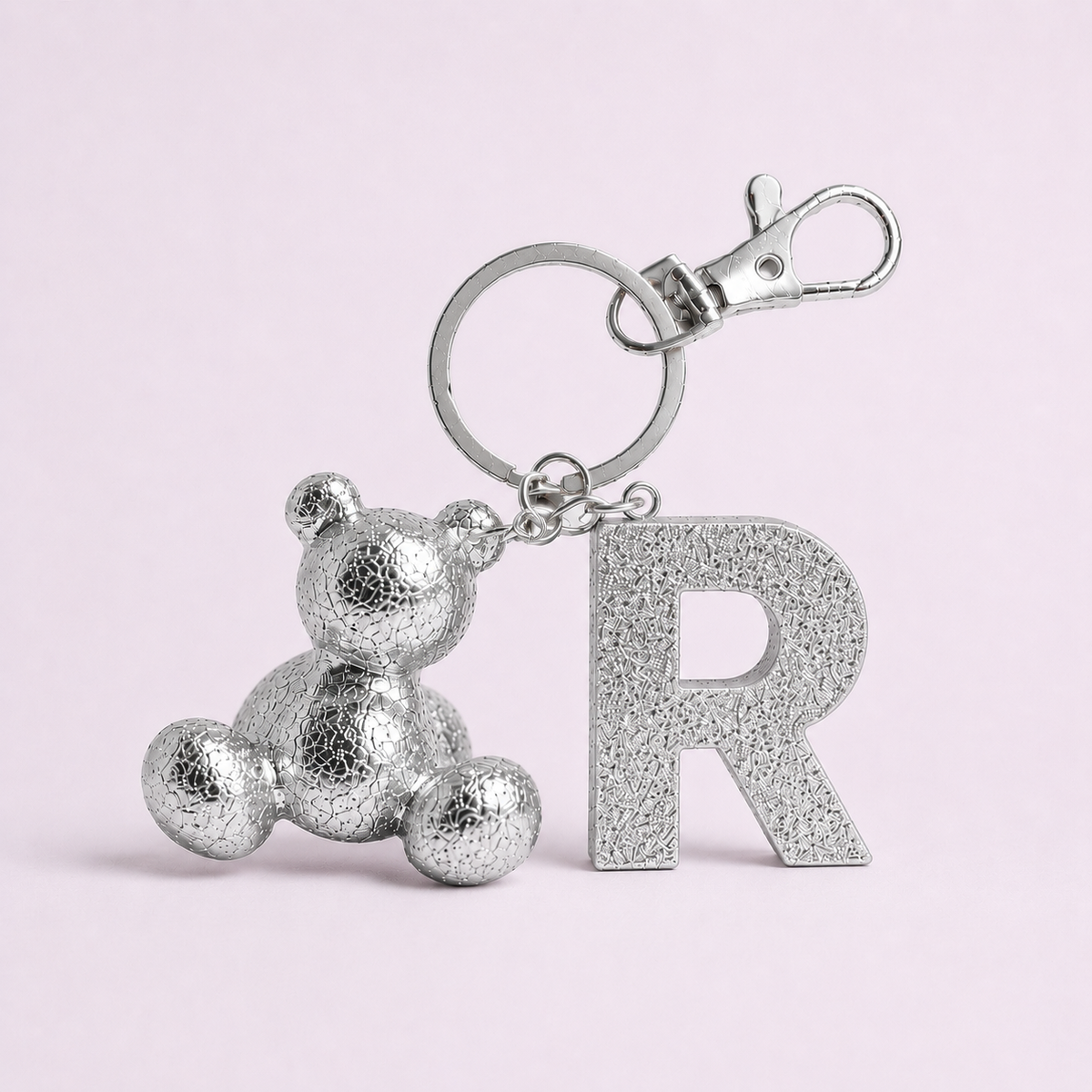 Silver handmade resin bear keychain with the letter R