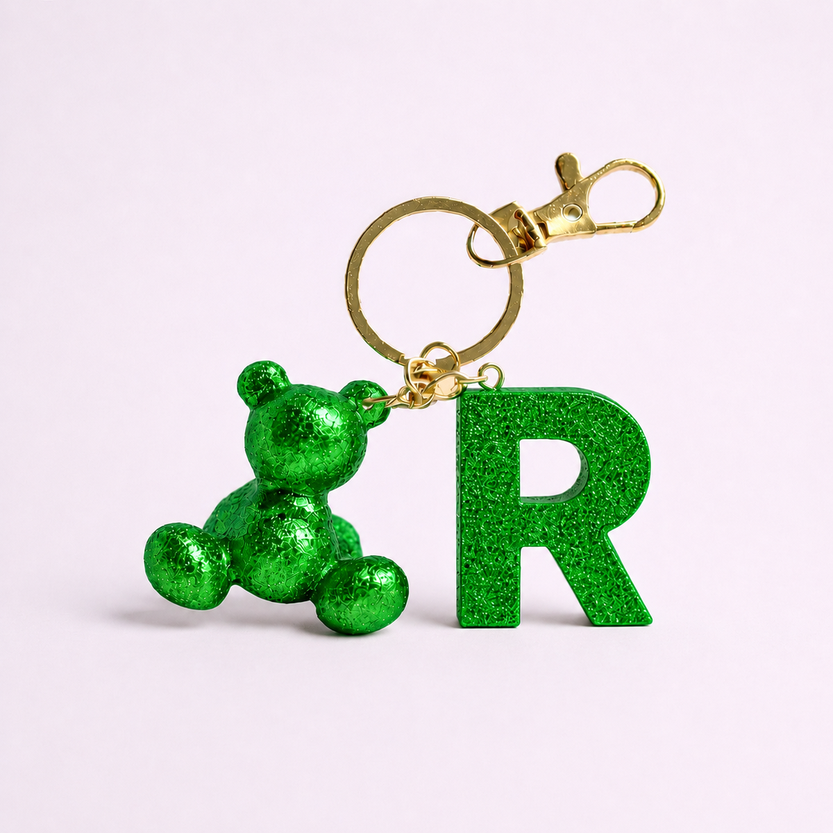 Green handmade resin bear keychain with the letter R