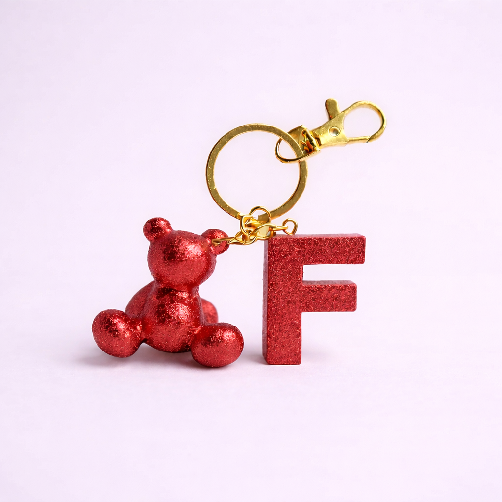 Red handmade resin bear keychain with the letter F
