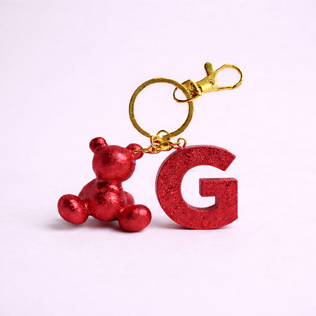 Red handmade resin bear keychain with the letter G