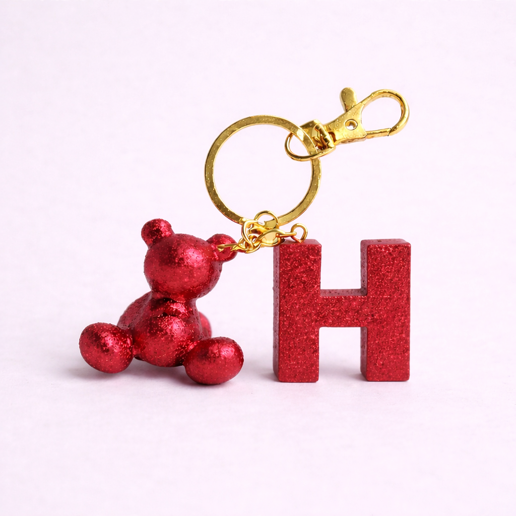 Red handmade resin bear keychain with the letter H