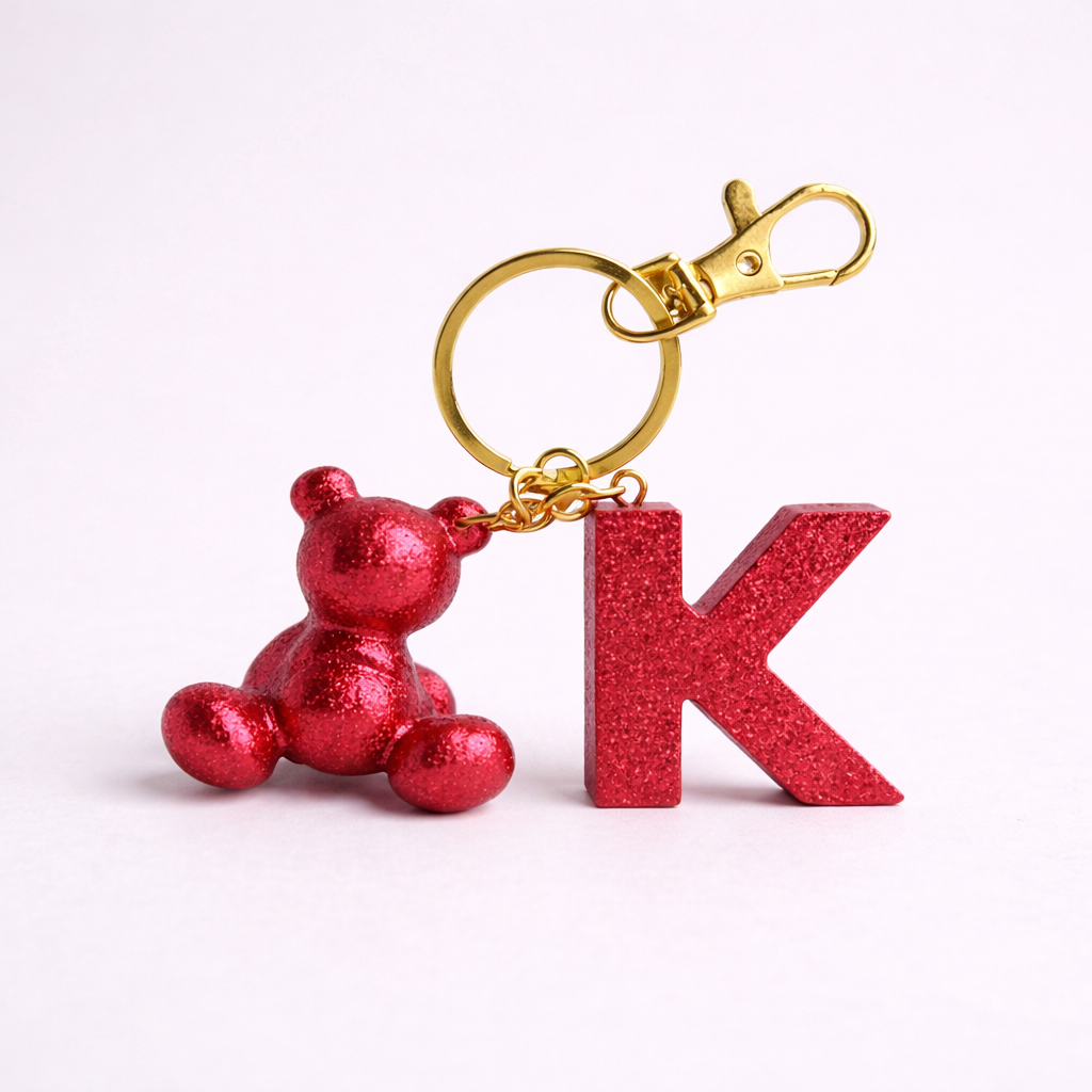 Red handmade resin bear keychain with the letter K