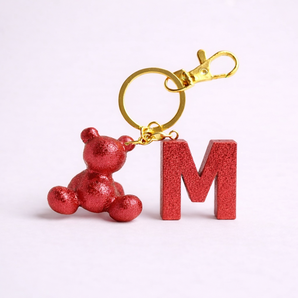 Red handmade resin bear keychain with the letter M