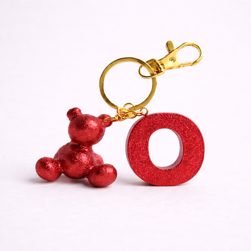 Red handmade resin bear keychain with the letter O