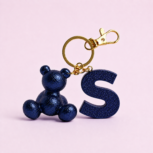 Blue handmade resin bear keychain with the letter S