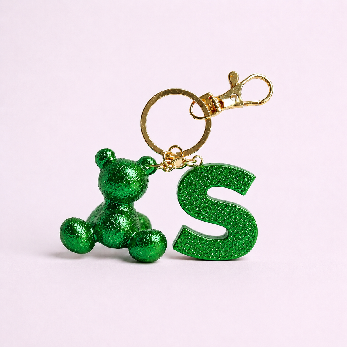 Green handmade resin bear keychain with the letter S