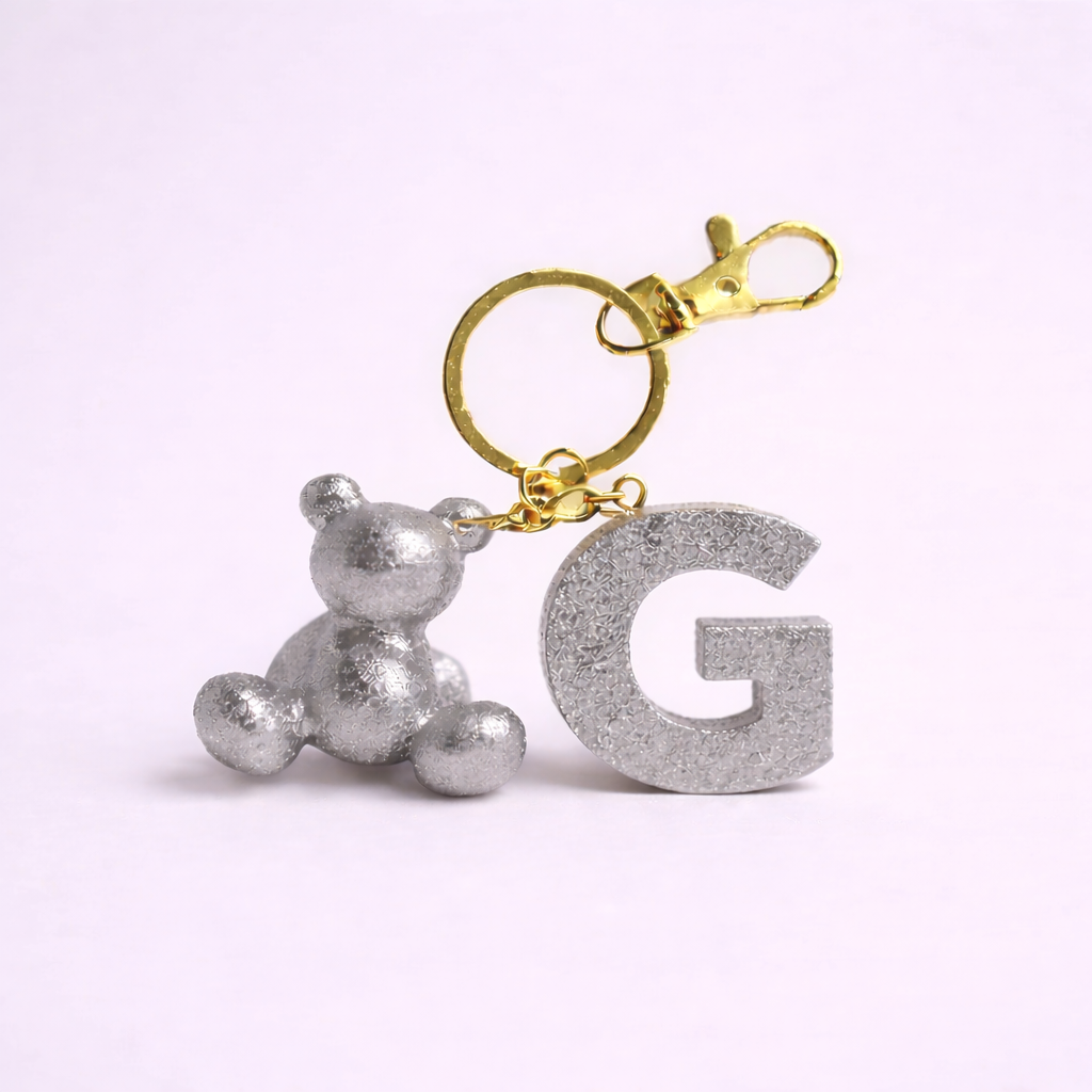 Silver handmade resin bear keychain with the letter G