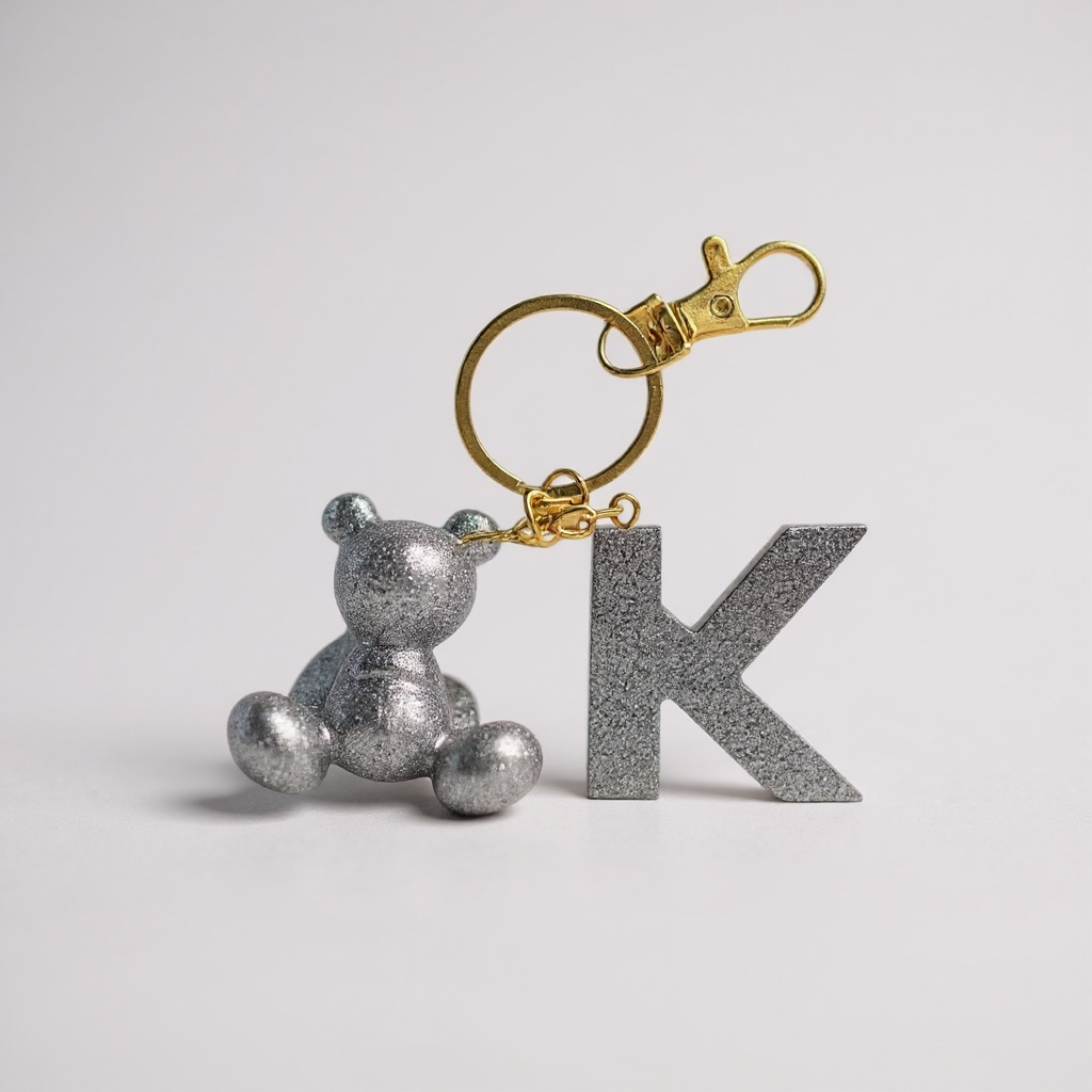Silver handmade resin bear keychain with the letter K