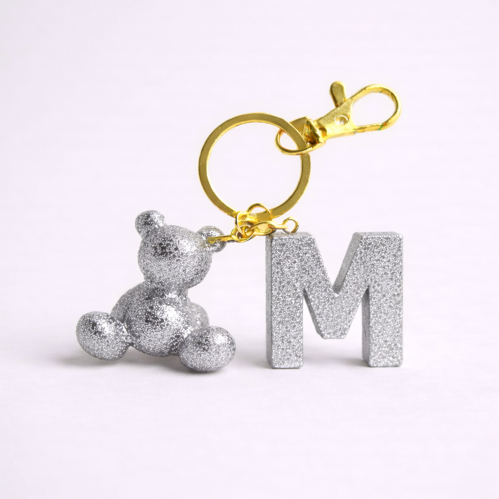 Silver handmade resin bear keychain with the letter M