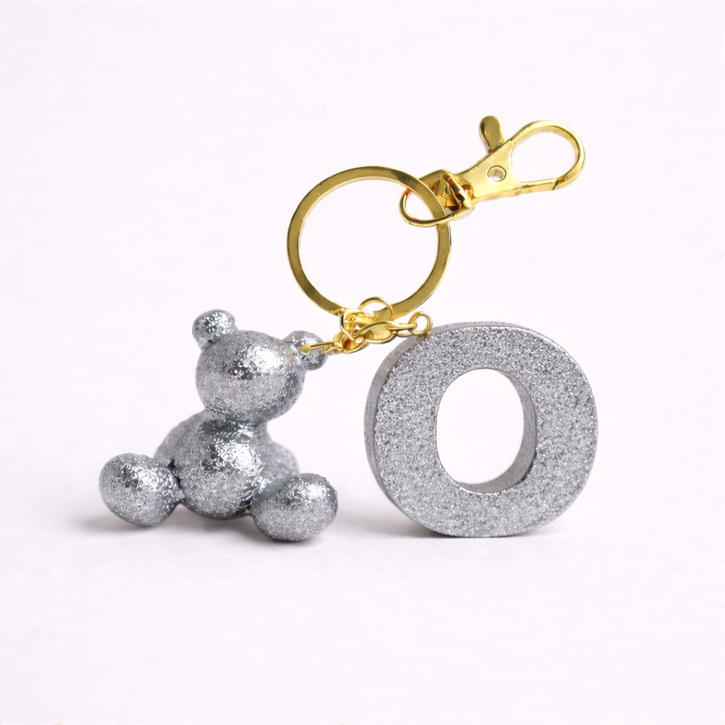Silver handmade resin bear keychain with the letter O