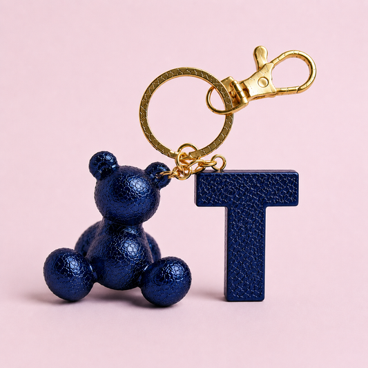 Blue handmade resin bear keychain with the letter T
