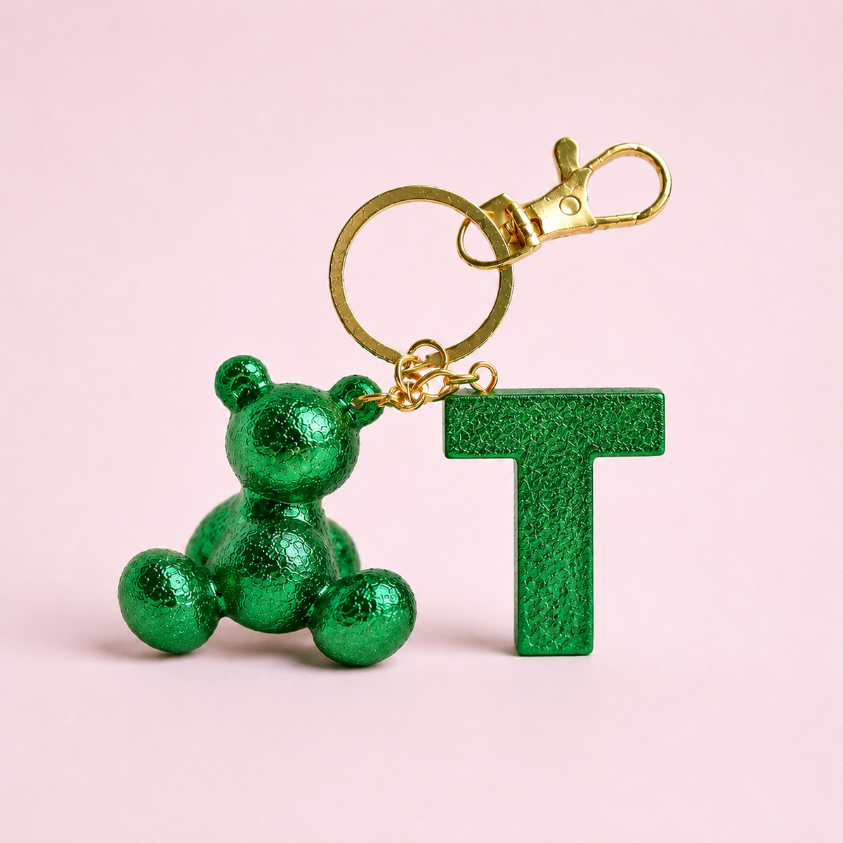 Green handmade resin bear keychain with the letter T