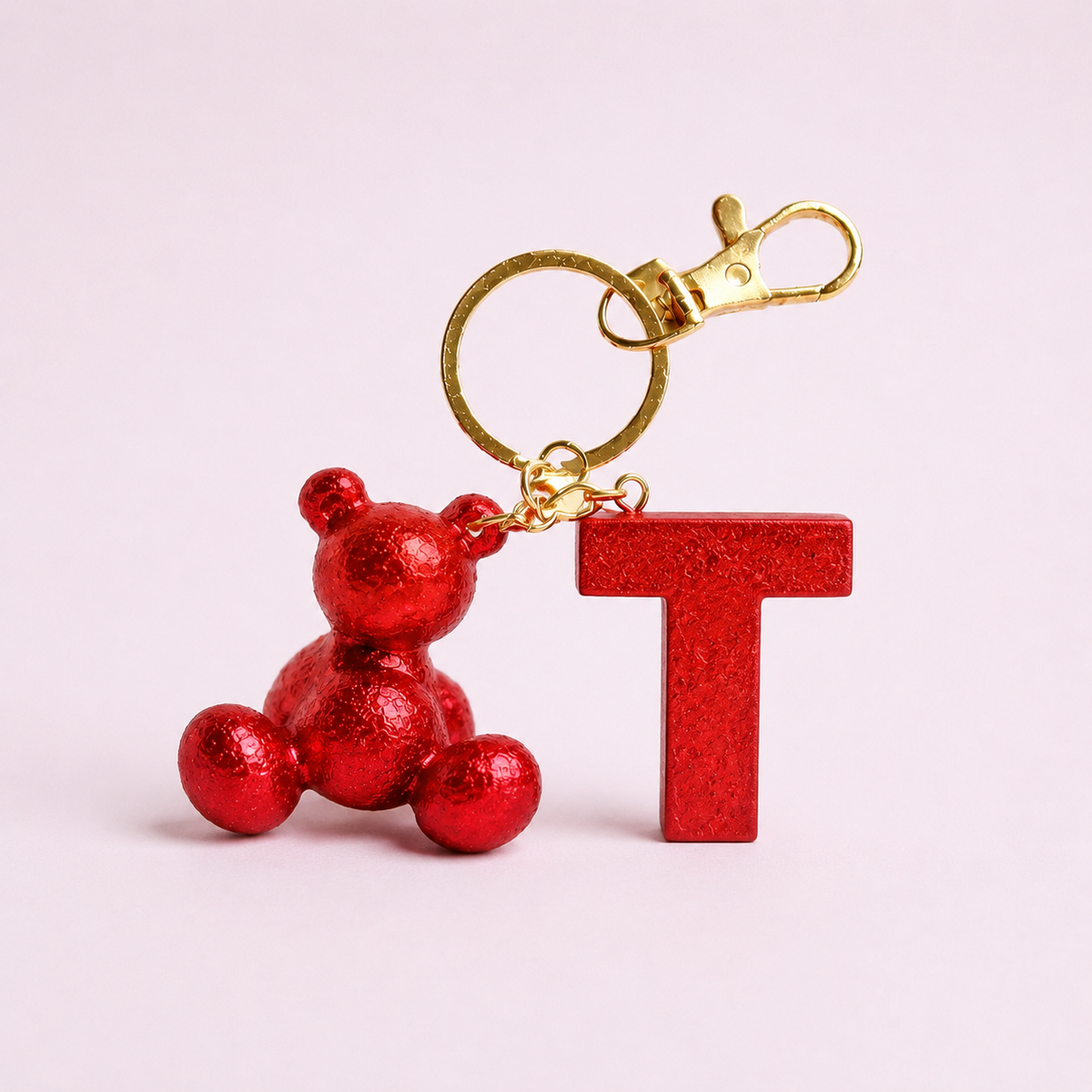 Red handmade resin bear keychain with the letter T