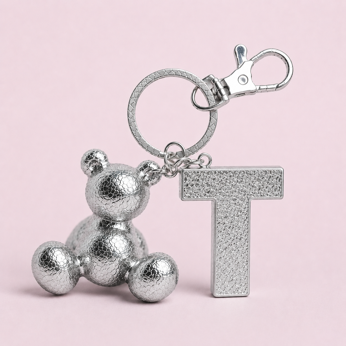 Silver handmade resin bear keychain with the letter T
