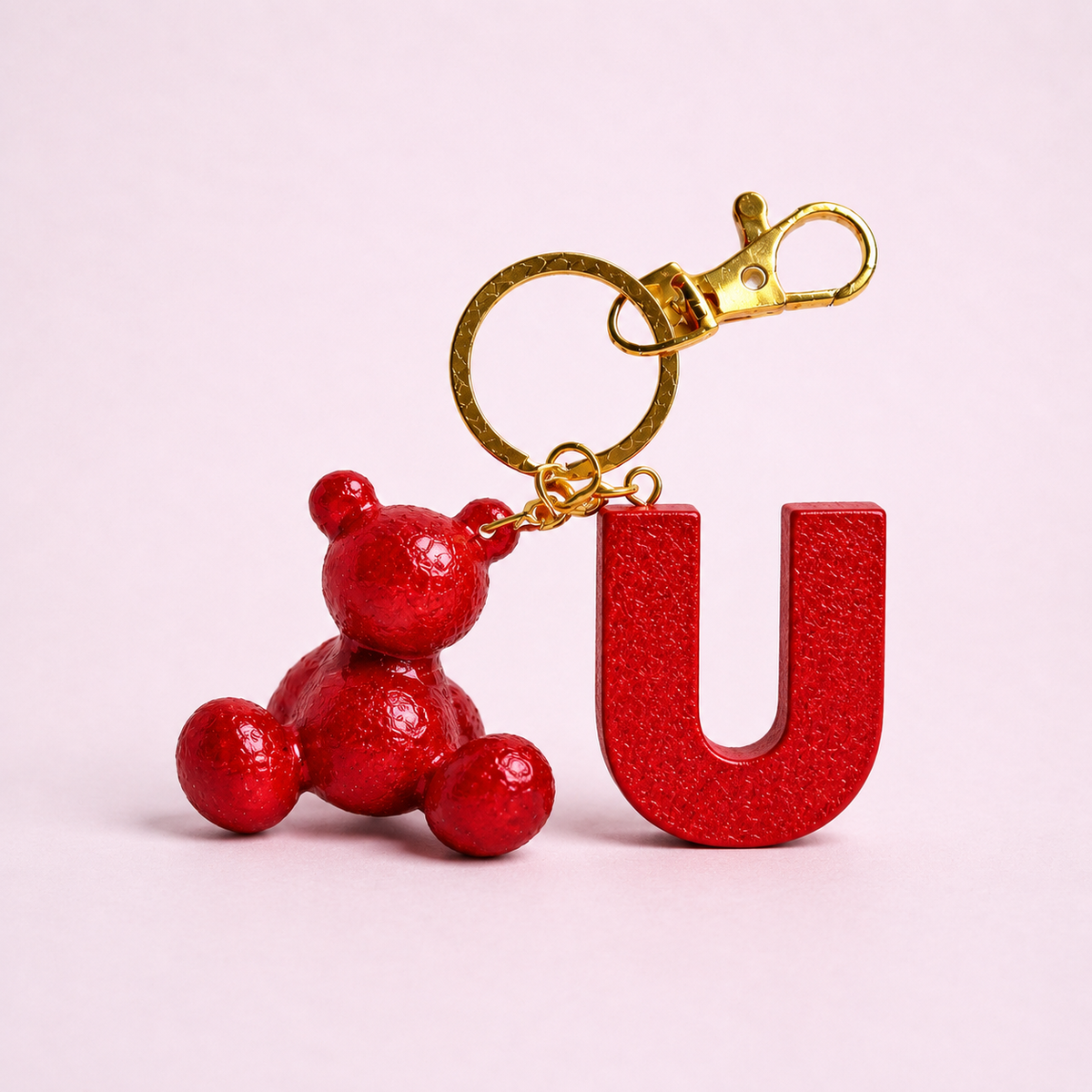 Red handmade resin bear keychain with the letter U