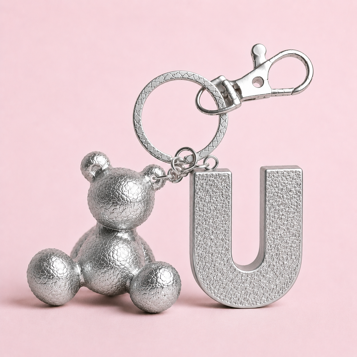 Silver handmade resin bear keychain with the letter U