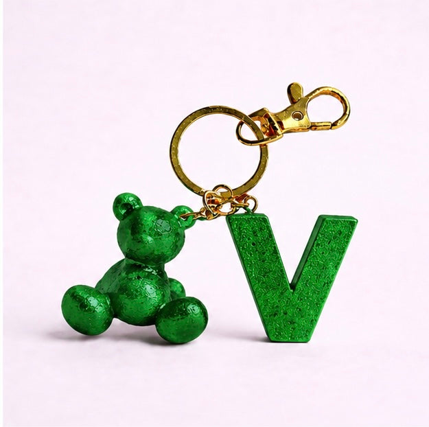 Green handmade resin bear keychain with the letter V