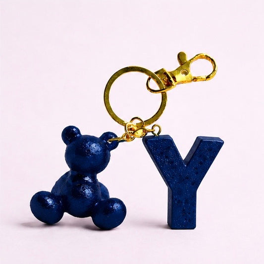 Blue handmade resin bear keychain with the letter Y