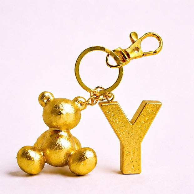 Gold handmade resin bear keychain with the letter Y