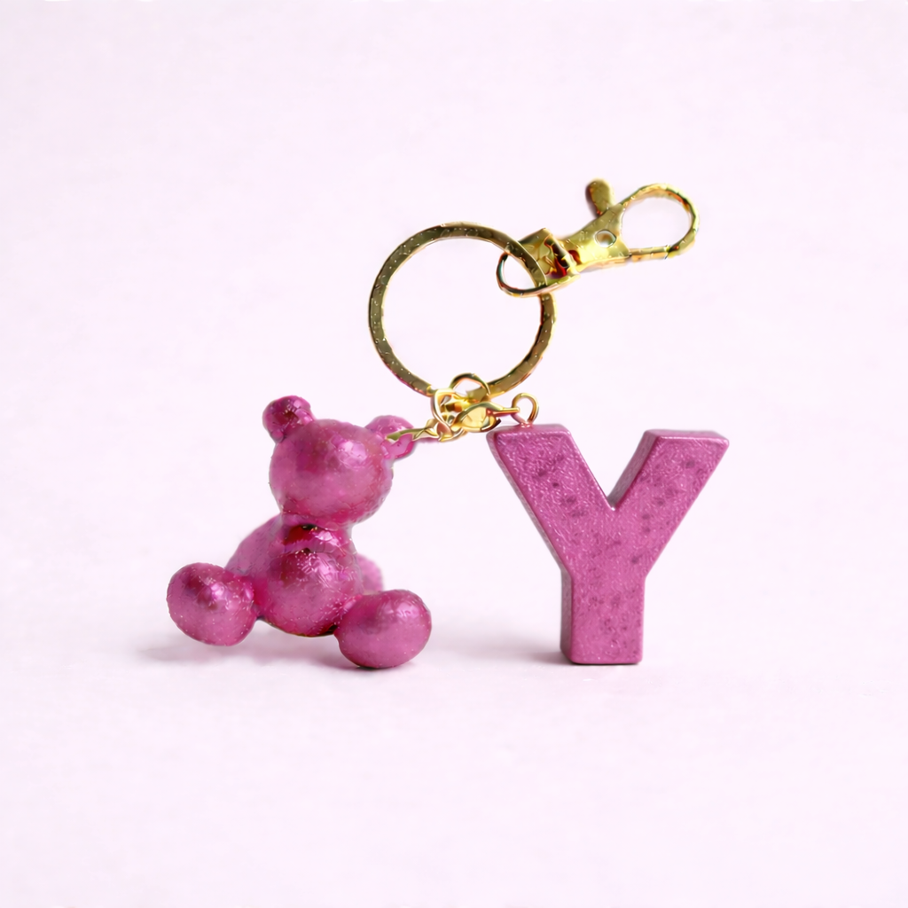 Pink handmade resin bear keychain with the letter Y