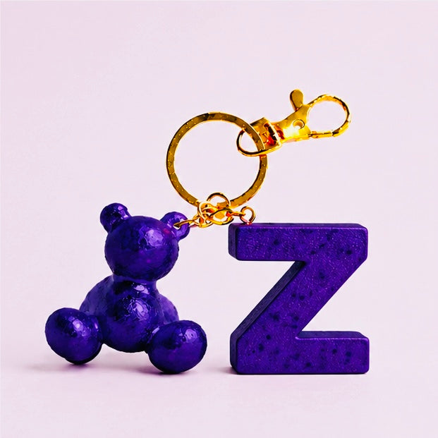 Purple handmade resin bear keychain with the letter Z