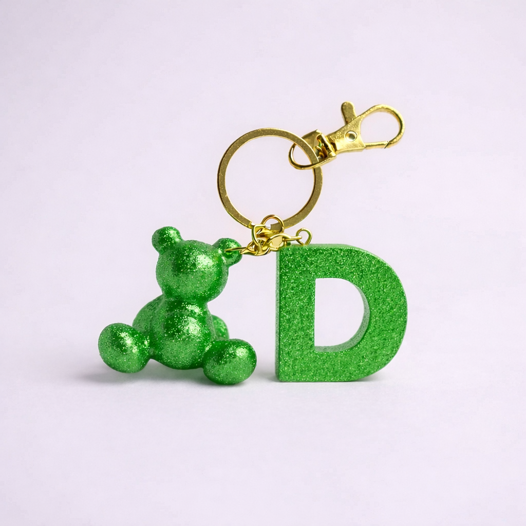 Green handmade resin bear keychain with the letter D