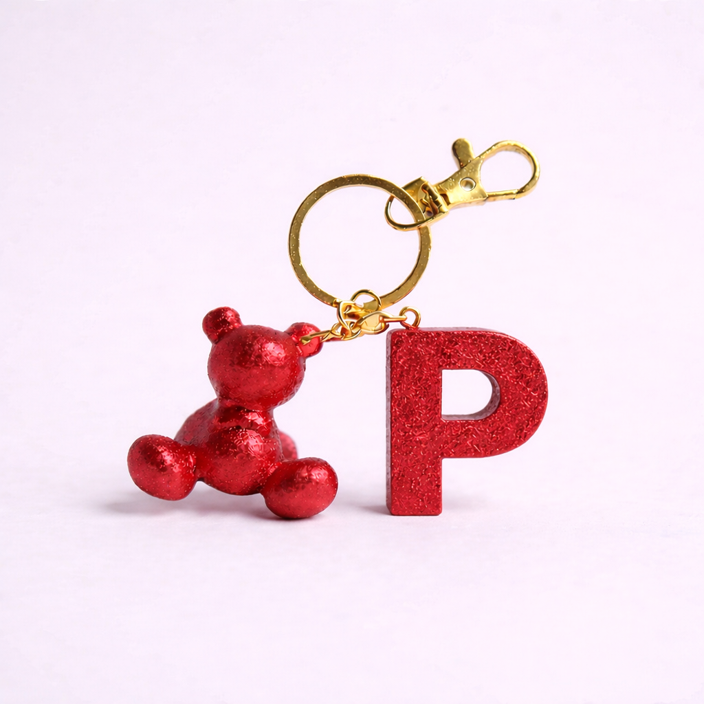 Red handmade resin bear keychain with the letter P
