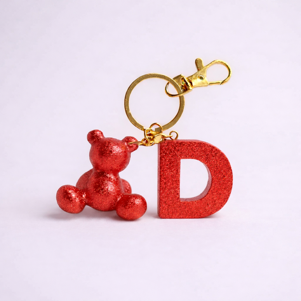 Red handmade resin bear keychain with the letter D