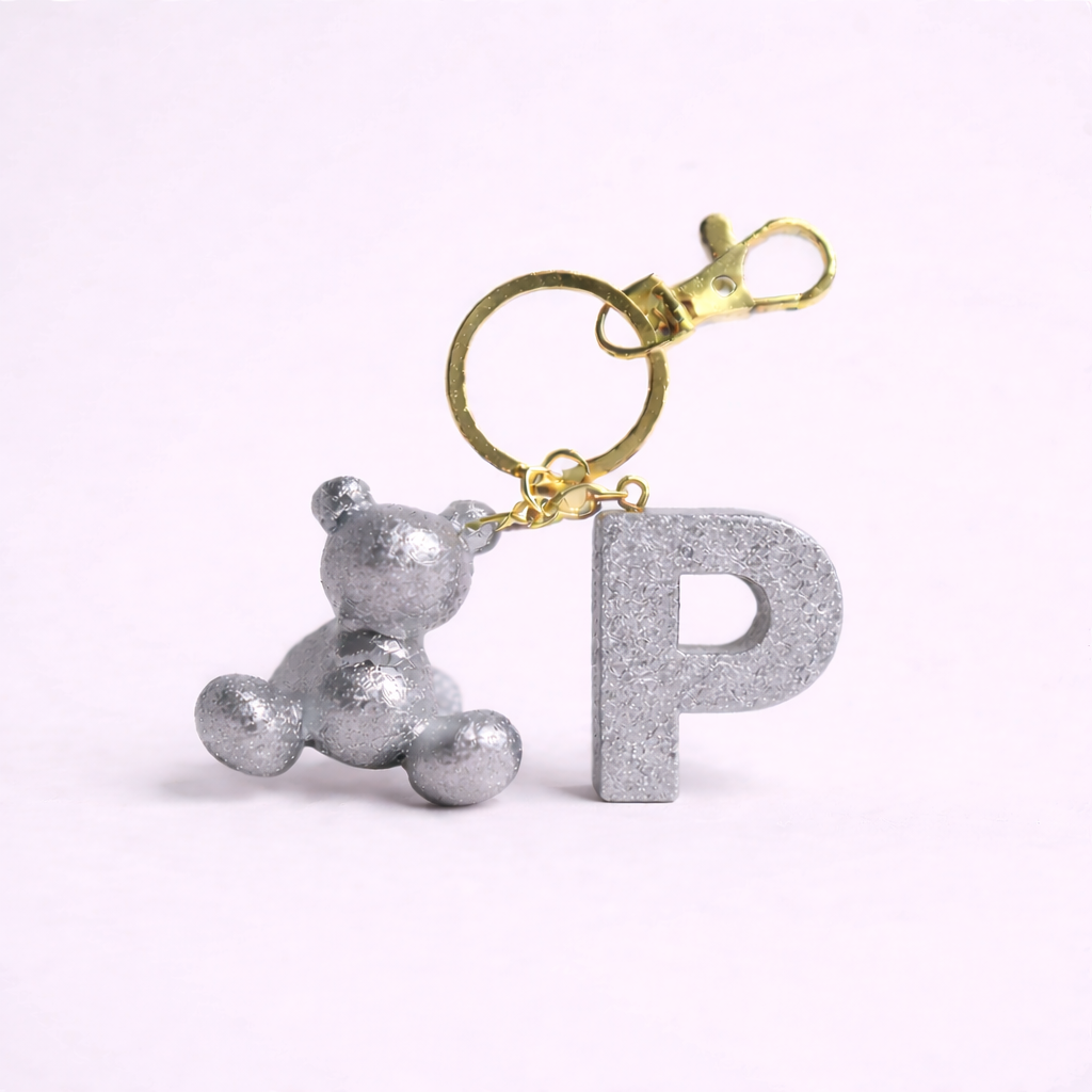 Silver handmade resin bear keychain with the letter P