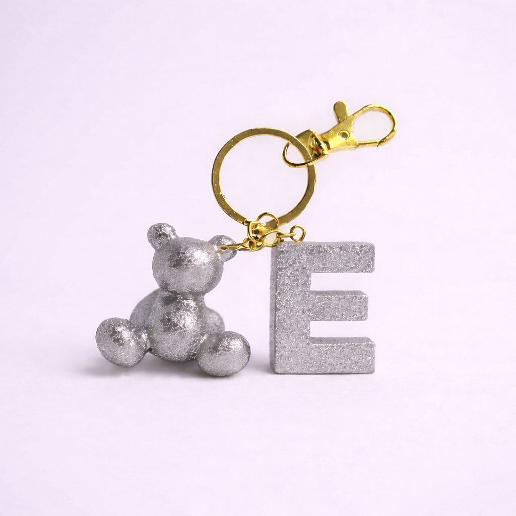 Silver handmade resin bear keychain with the letter E